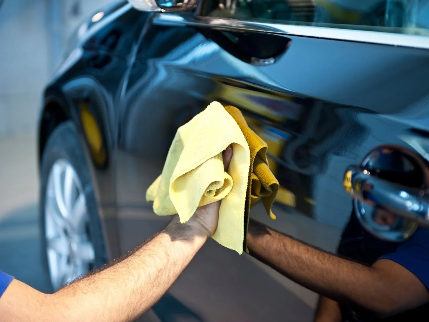 Soft microfibre towel finishing glossy black paintwork