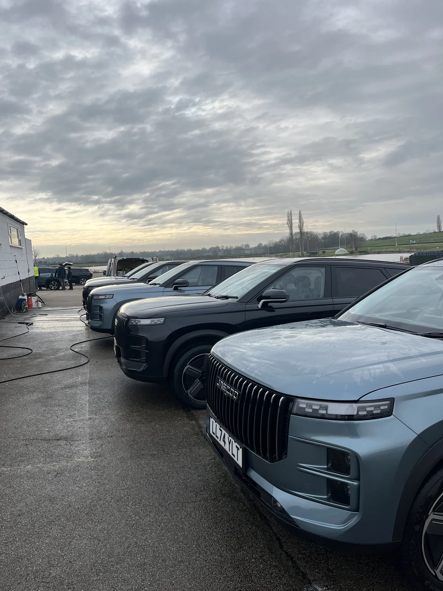 A line of professionally cleaned large SUVs