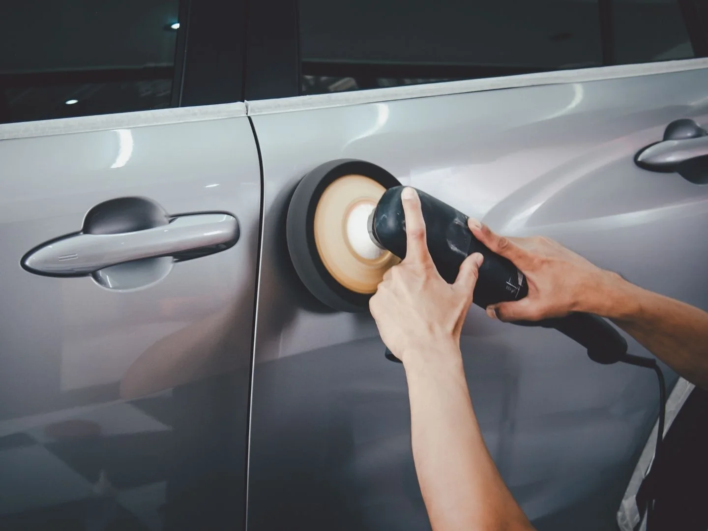 Vehicle paintwork being refined with a machine polisher
